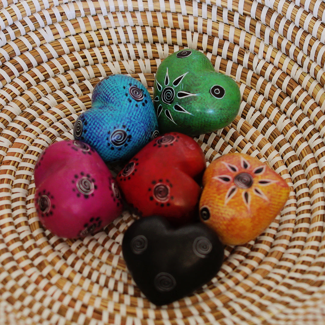 Colorful soapstone hearts that are a fair trade gift idea for meaningful handmade home decor. 