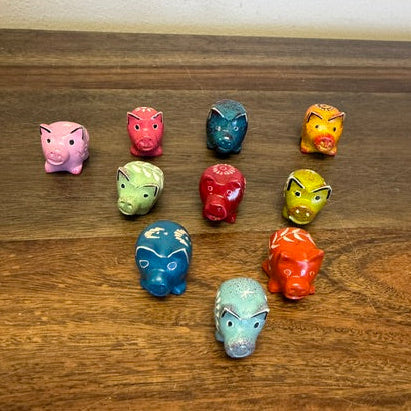 Assorted fair trade soapstone pig figurines hand-carved in Kenya in mixed colors