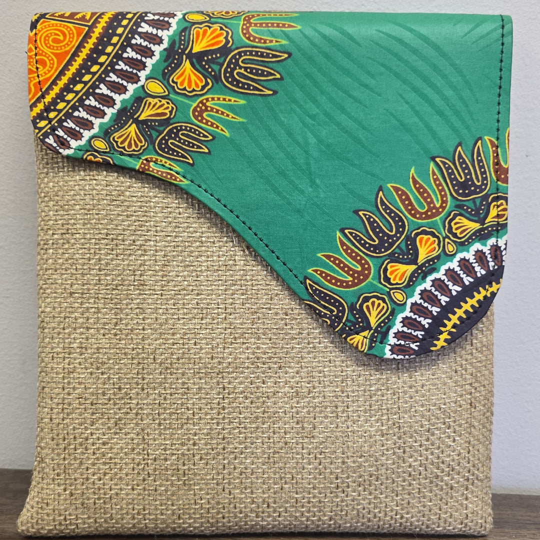taupe crossbody bag with an African printed flap. Bag is unisex.