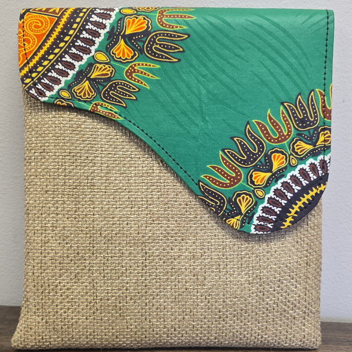 taupe crossbody bag with an African printed flap. Bag is unisex.
