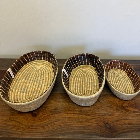 Three sizes, small, medium and large of our brown cloth lined woven bread basket bowl.
