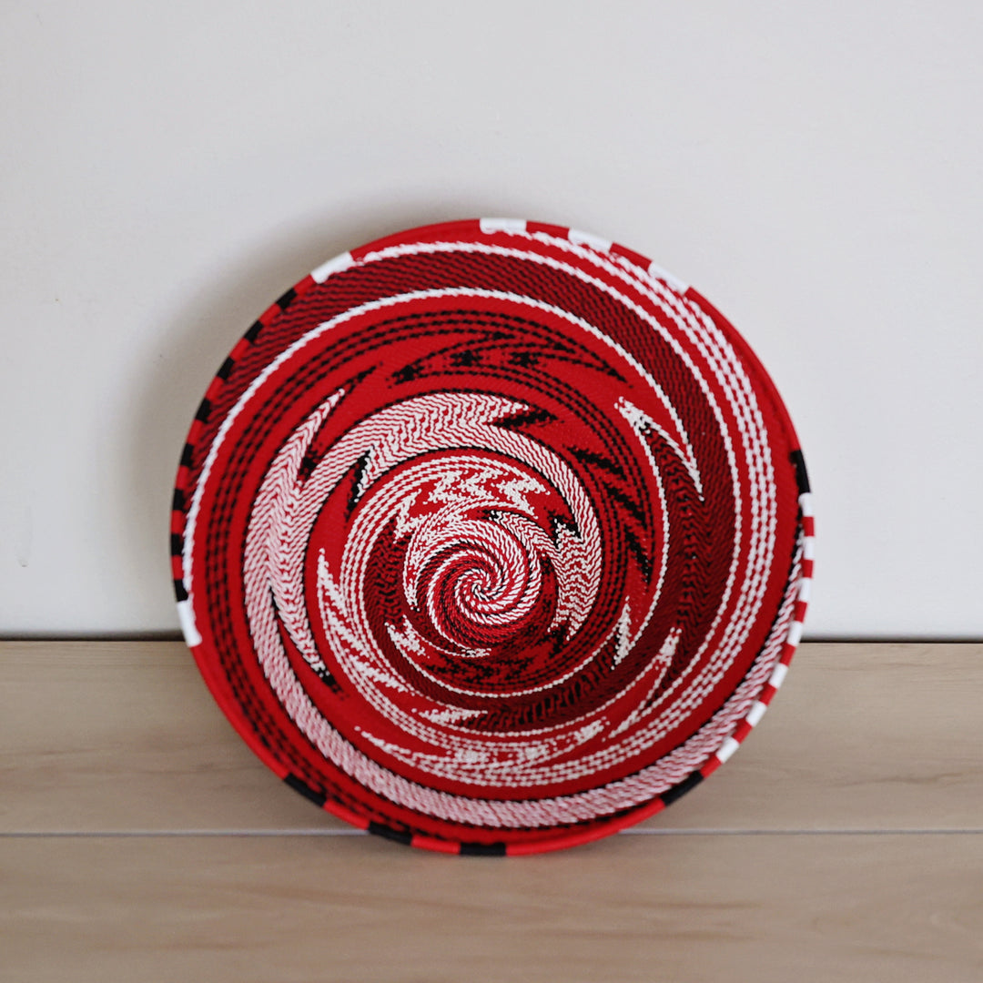 Top view of the Fire & Ice Zulu wire basket handwoven in South Africa with bold red, white and black geometric patterns.