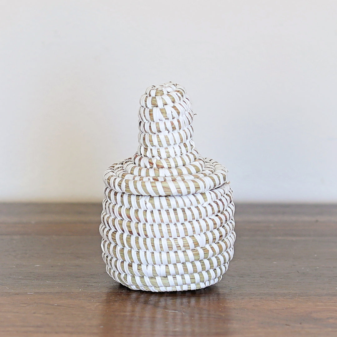 Natural white mini sweetgrass basket with lid handmade in Senegal.