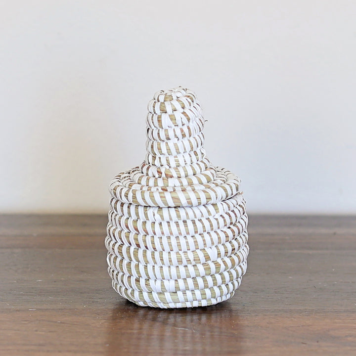 Natural white mini sweetgrass basket with lid handmade in Senegal.