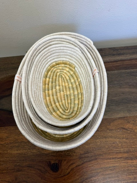 Three sizes of our white trimmed bread baskets, stacked up for easy storage. 