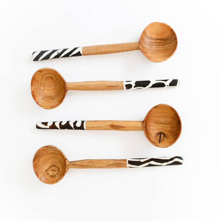 Eco-friendly wood and bone cutlery set handmade by artisans using traditional techniques.