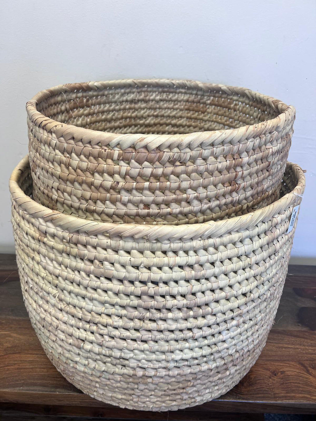 Handwoven XL palm leaf basket used for storing blankets and home essentials, eco-friendly and fair trade.