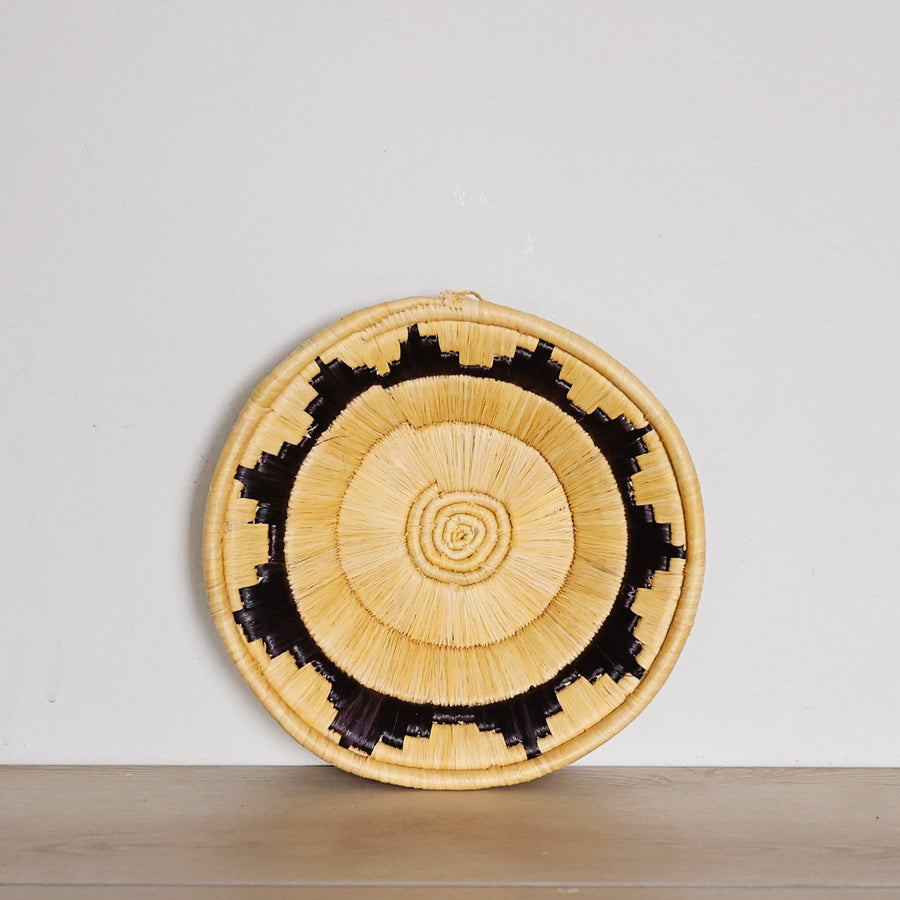 Handwoven Yellow & Black Bukedo and Raffia basket bowl handmade in Uganda for fair trade wall décor and tabletop styling.