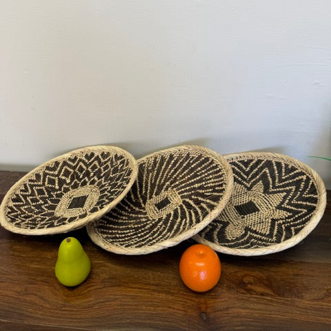 Zambia Tonga flat basket trays with geometric woven design handmade by artisans in Africa.