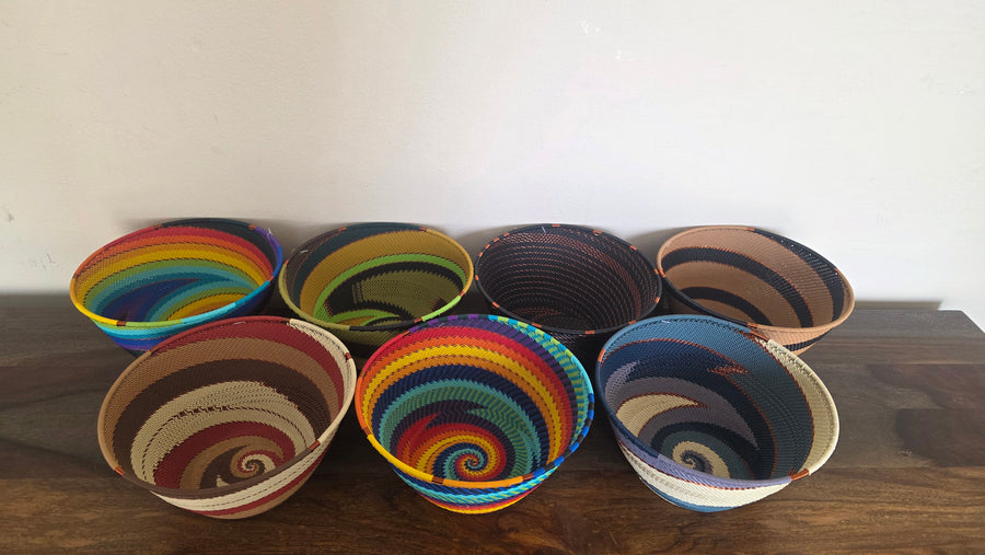 Handwoven Zulu wire deep bowl from South Africa with colorful geometric pattern