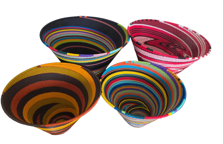 Handwoven Zulu wire deep funnel bowl from South Africa featuring colorful geometric patterns
