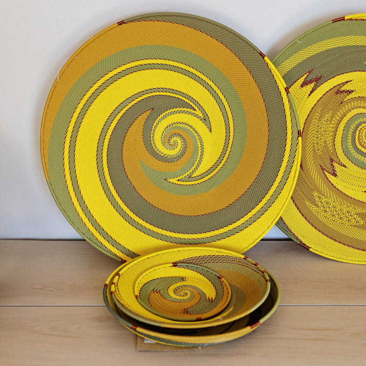 Papaya Zulu Large Tray handwoven in South Africa with sunny yellow and papaya orange in a diagonal stripe pattern.